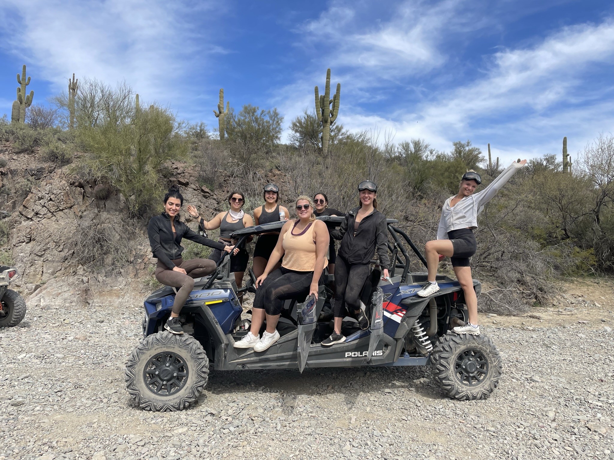 Bachelorette group celebrating during a Scottsdale UTV tour in the Arizona desert